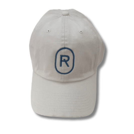 White cap with a blue Emerge 'R' logo emrboidery